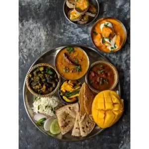Dal Tadka, Bhindi Sabzi, Rajma Masala, Soya Chaap Tikka Masala, Mango Pickle, Chapati, Rice.