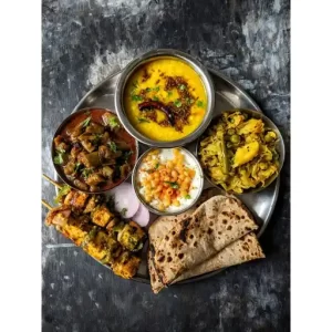 Masoor Dal, Cabbage Sabzi, Ridge Gourd Curry, Paneer Tikka, Raita, Boondi Raita, Tandoori Paratha.