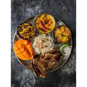Masoor Dal, Punjabi Arbi Masala, Papad Ki Sabzi, Jeera Rice, Tandoor Chapati, Mango.