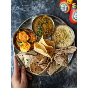 Sabut Masoor Dal, Egg Masala Curry, Seviyan Kheer, Papad, and Chapati.